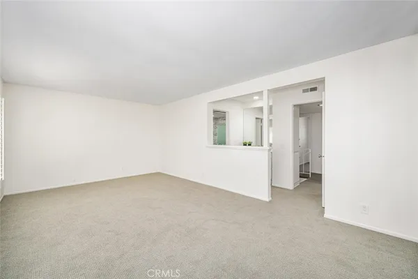 an empty room with a bathroom