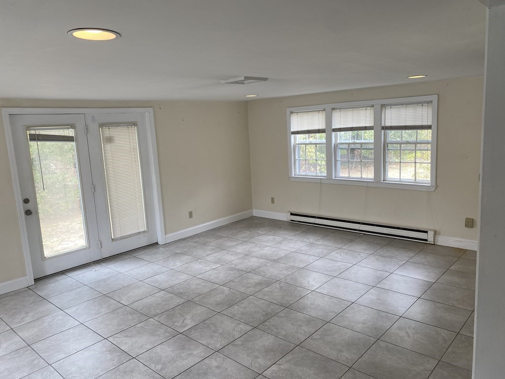 119 Longview Drive Barnstable, MA 02632 - Photo 4 of 5 an empty room with windows