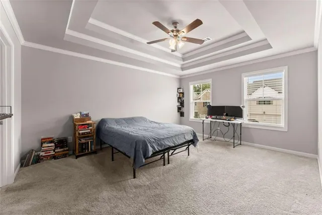 a bedroom with a bed furniture and a chandelier