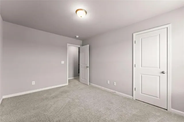 an empty room with closet area