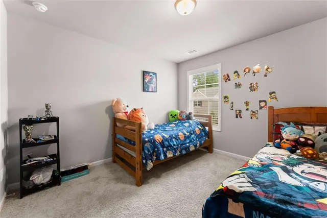 a bedroom with a bed and a tv in it