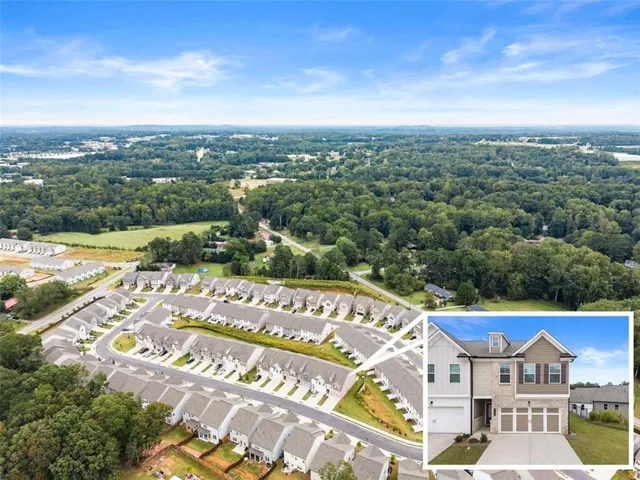 an aerial view of residential building and car parked
