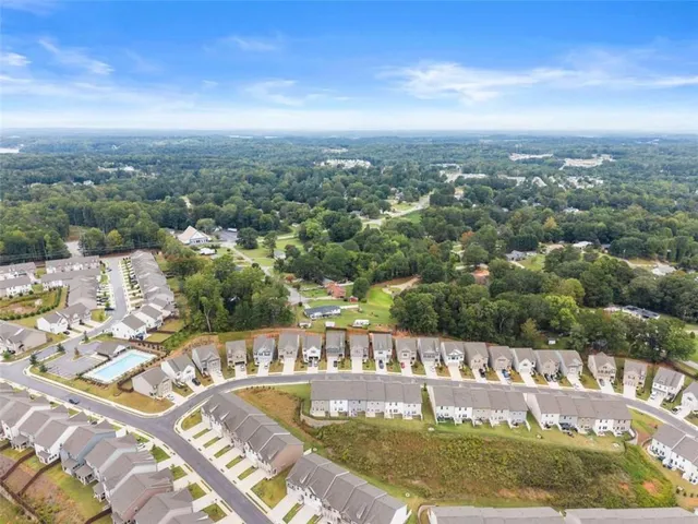 a view of a swimming pool with a yard