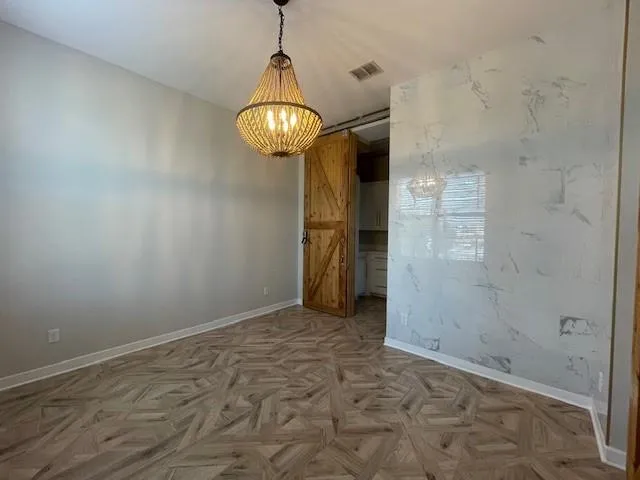 a bathroom with a sink a toilet a shower and a mirror