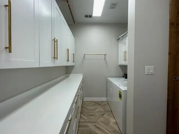 a view of a storage & utility room with wooden floor
