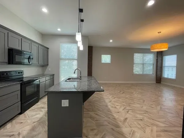 a kitchen with a sink and cabinets