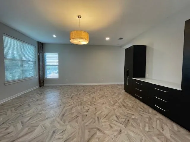 a view of a kitchen with a sink and a refrigerator