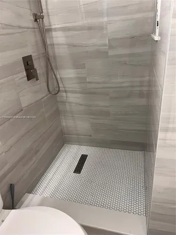 a bathroom with a sink and a shower