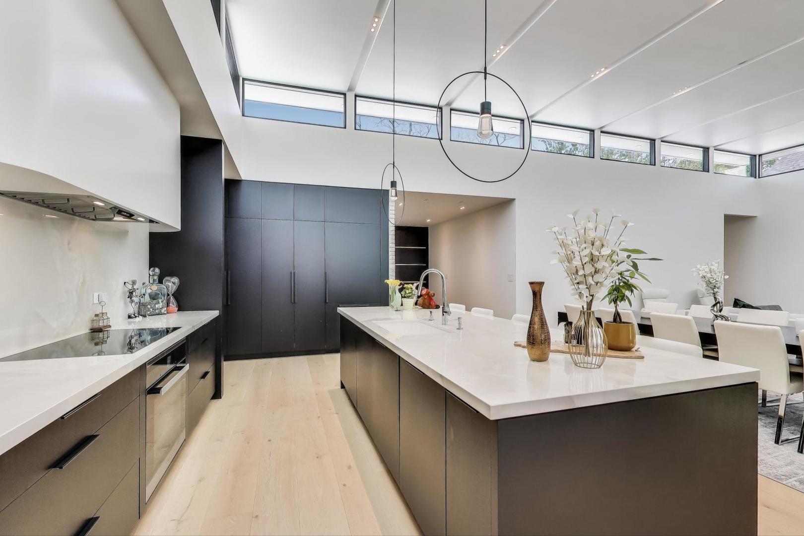 821 Harms Road Glenview, IL 60025 - Photo 12 of 41 a kitchen with kitchen island a sink appliances and cabinets