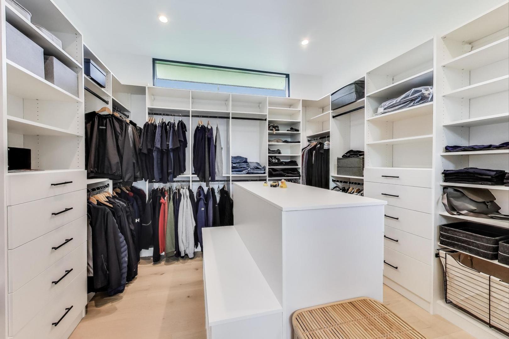 821 Harms Road Glenview, IL 60025 - Photo 19 of 41 a view of walk in closet with clothes and shoes