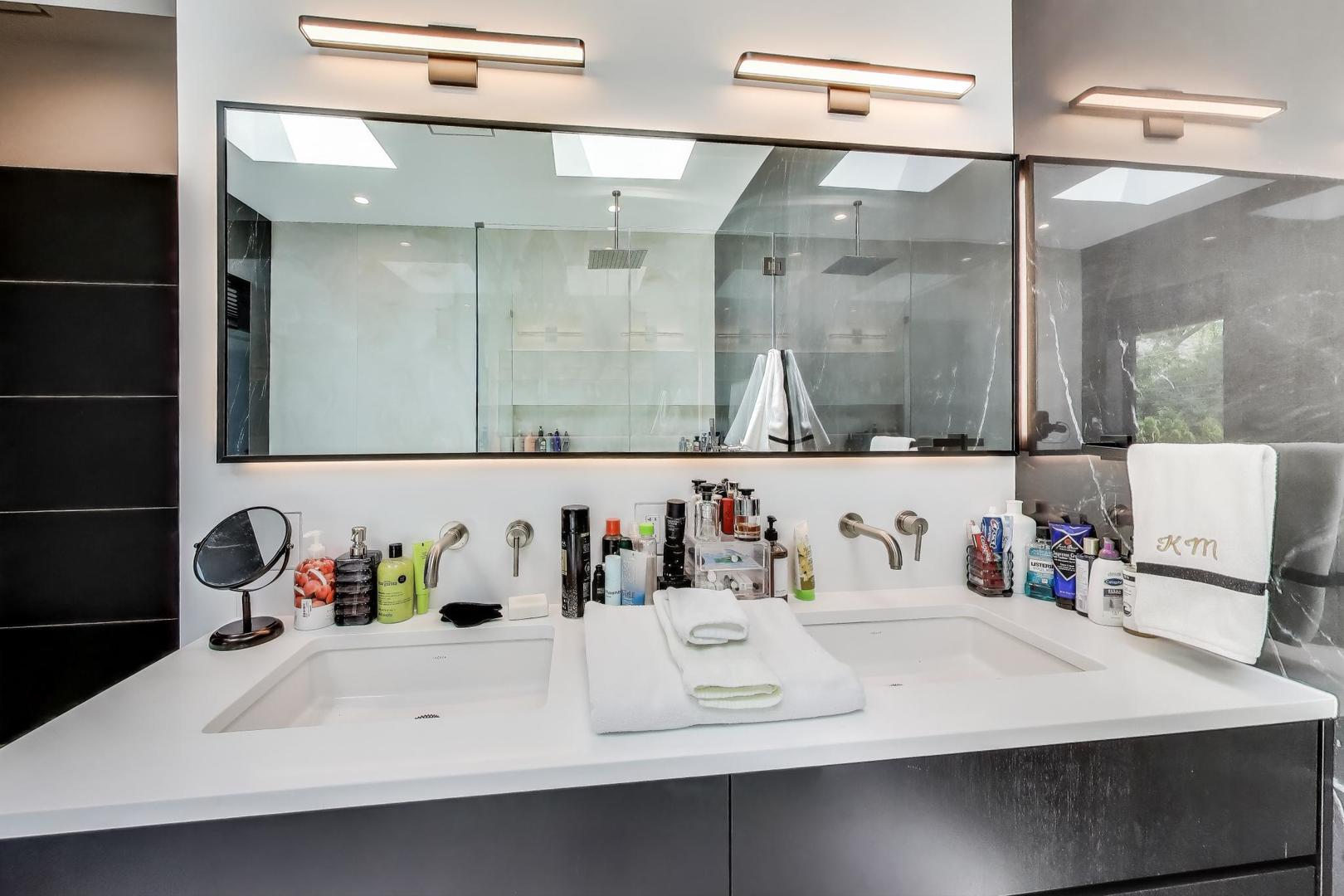 821 Harms Road Glenview, IL 60025 - Photo 22 of 41 a bathroom with a sink and a mirror