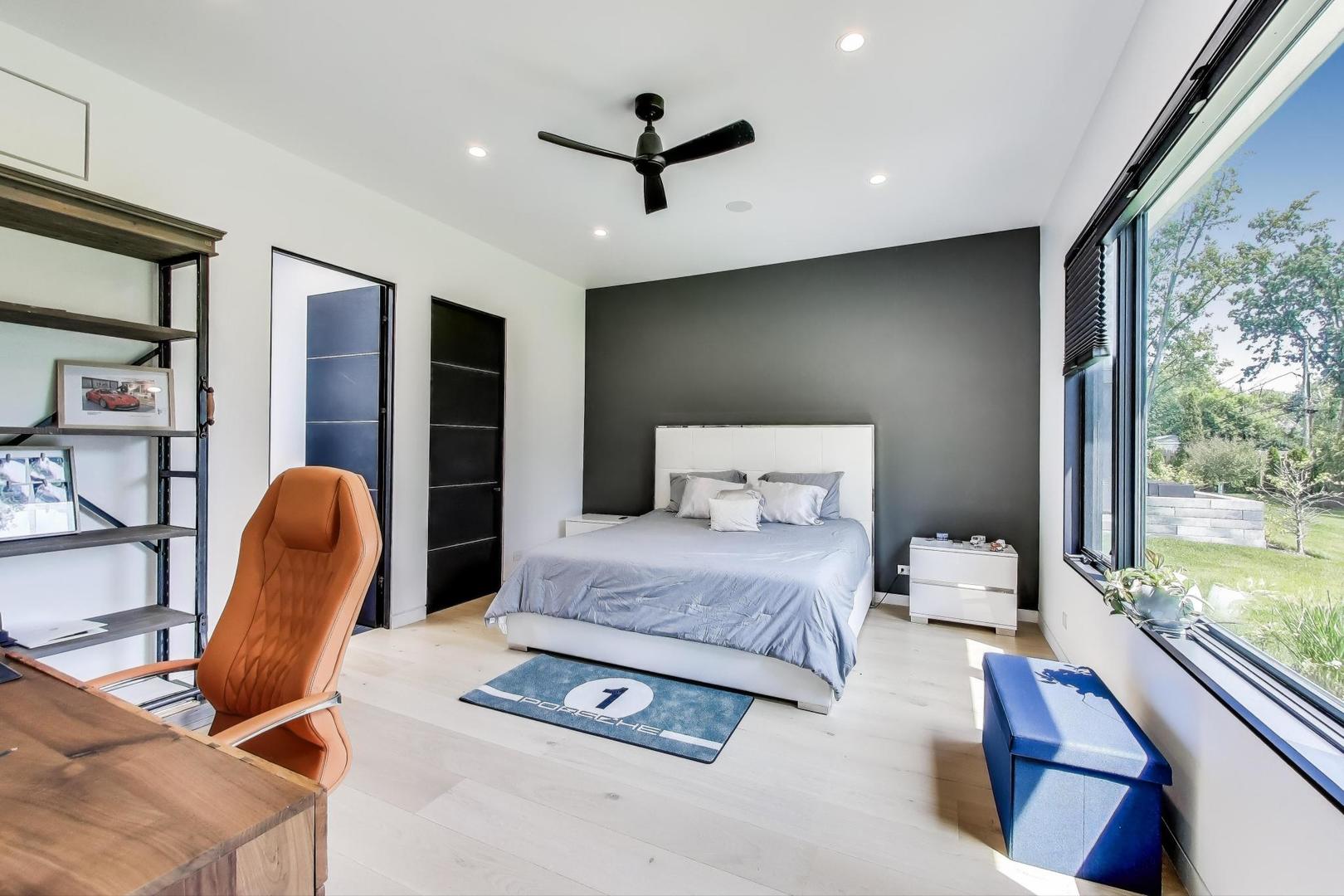 821 Harms Road Glenview, IL 60025 - Photo 23 of 41 a bedroom with a bed and wooden floor