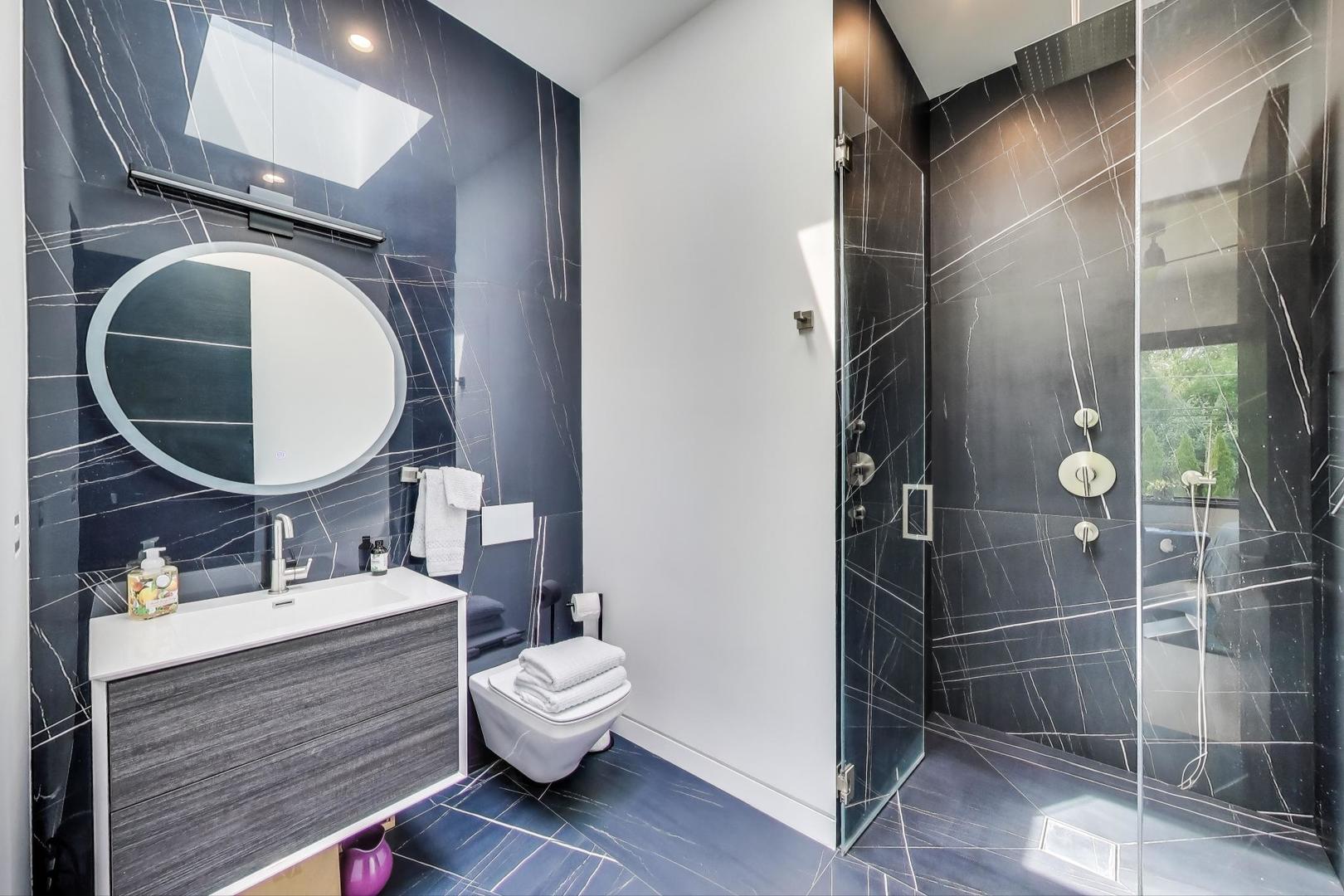 821 Harms Road Glenview, IL 60025 - Photo 24 of 41 a bathroom with a sink mirror and toilet