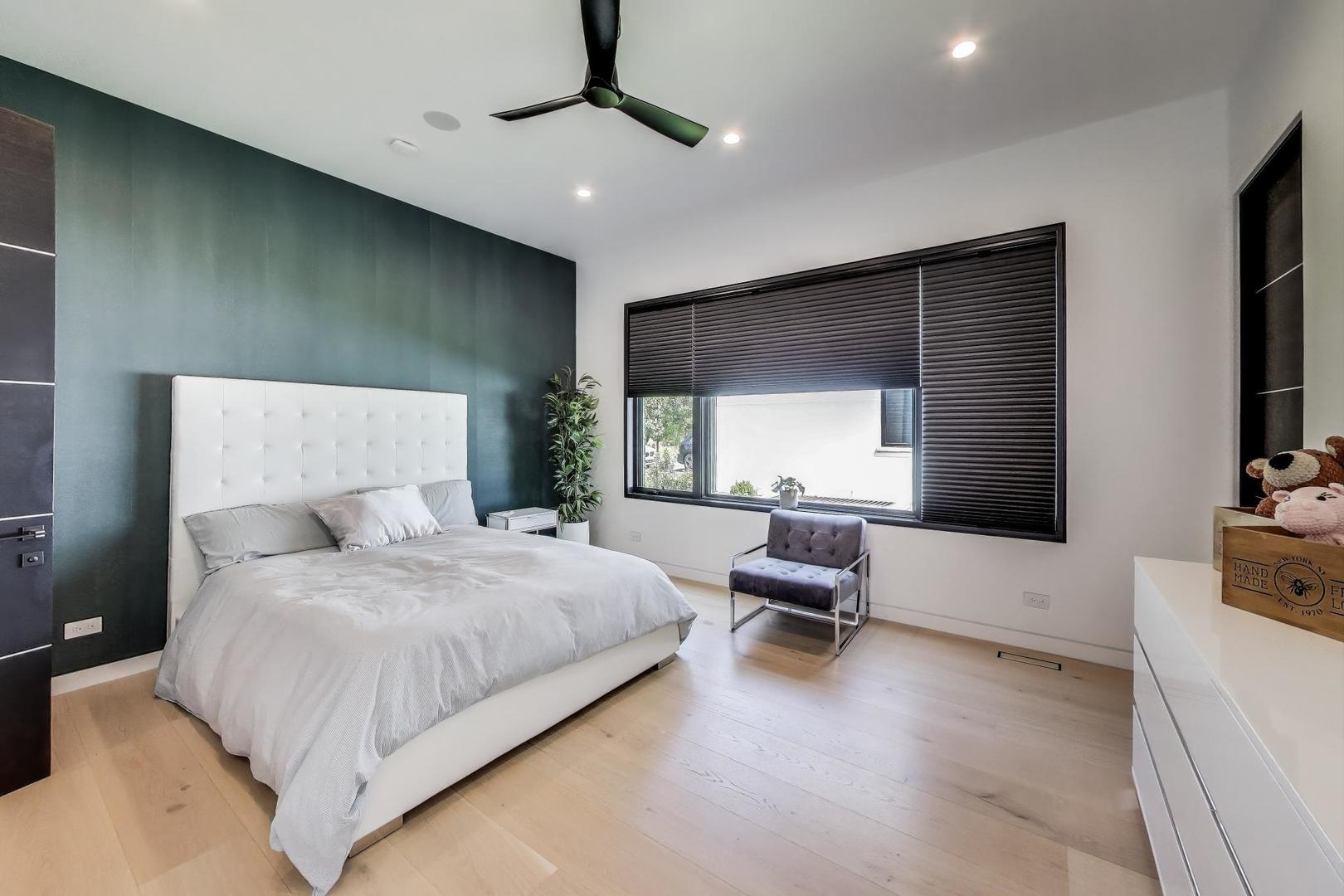 821 Harms Road Glenview, IL 60025 - Photo 25 of 41 a bedroom with a large bed and furniture