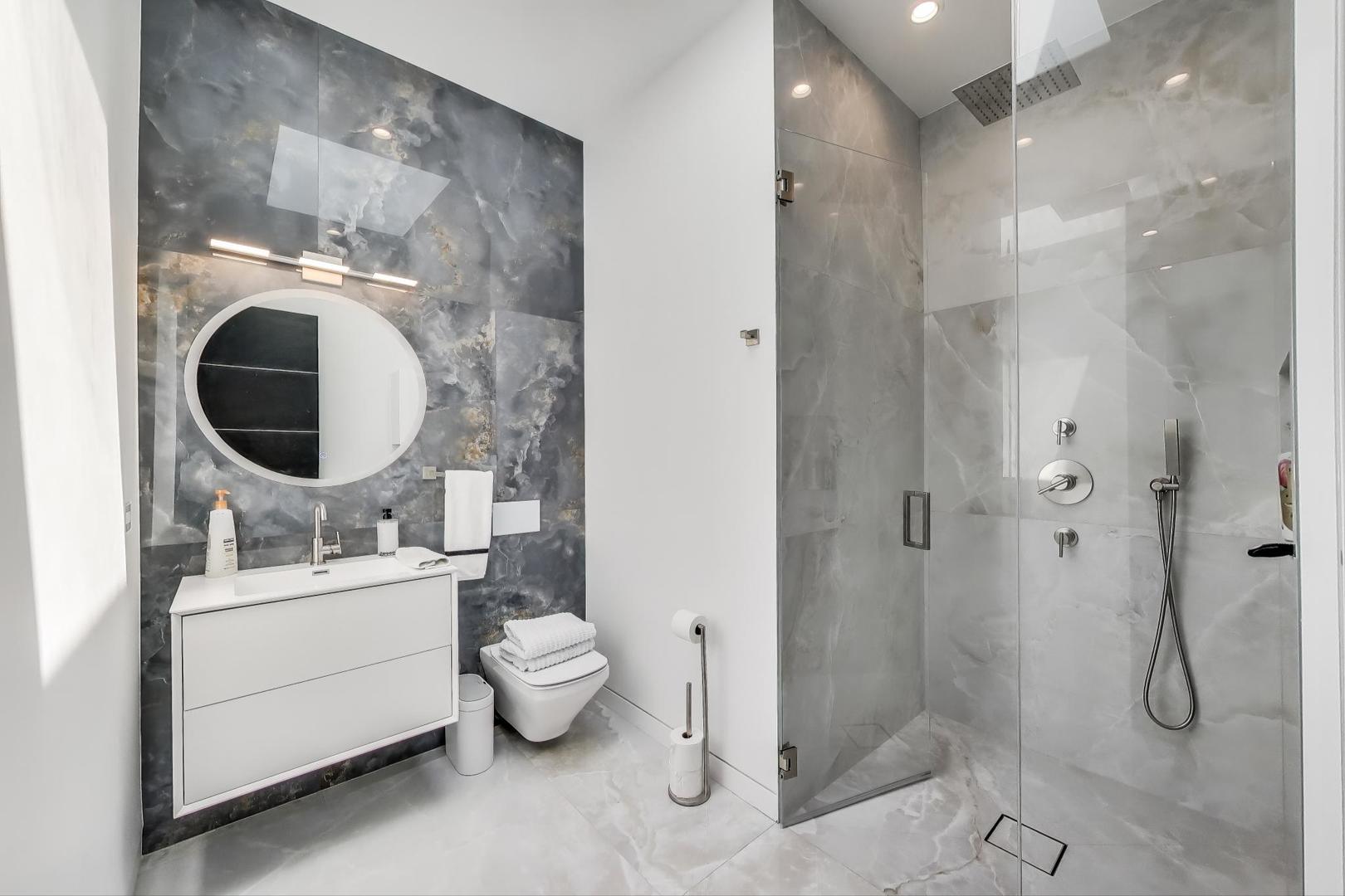 821 Harms Road Glenview, IL 60025 - Photo 26 of 41 a bathroom with a toilet sink and shower