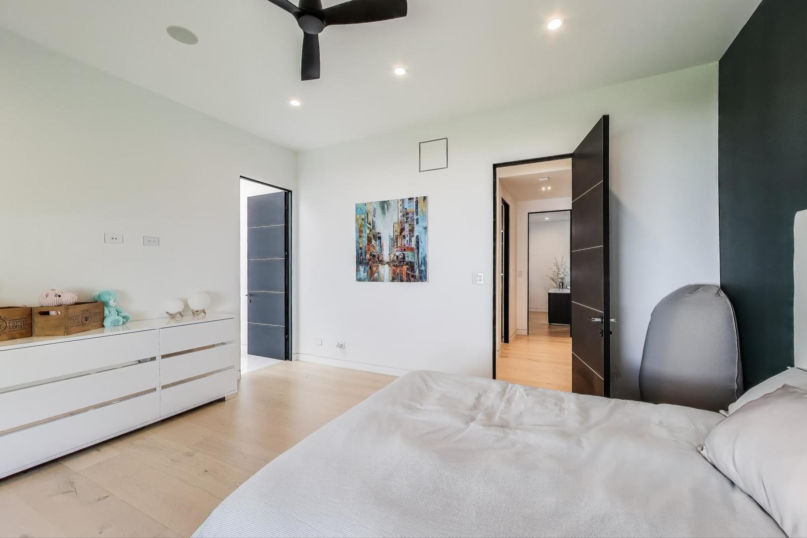 821 Harms Road Glenview, IL 60025 - Photo 27 of 41 a bedroom with furniture and window