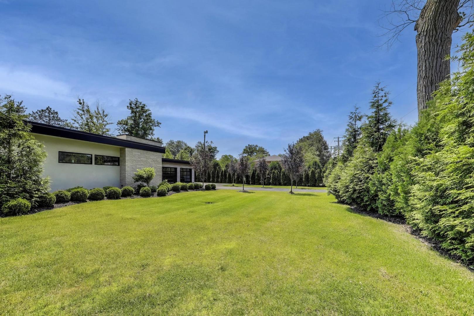 821 Harms Road Glenview, IL 60025 - Photo 38 of 41 a view of a backyard with plants and a patio
