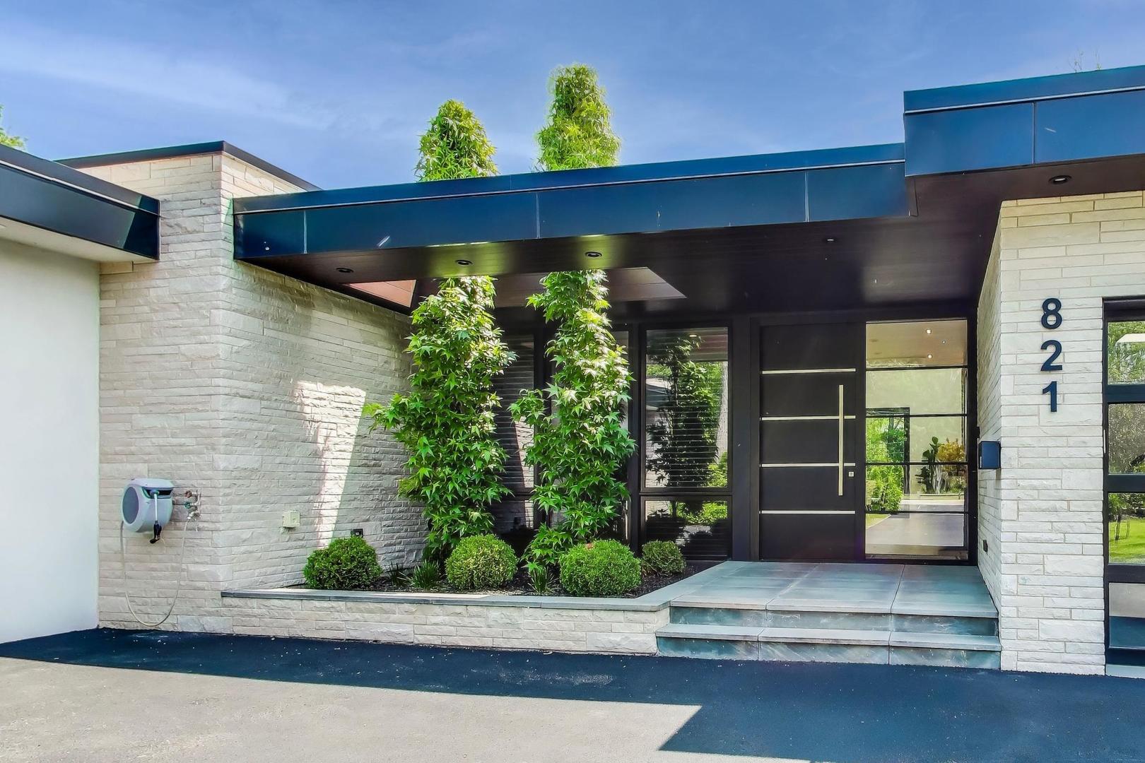 821 Harms Road Glenview, IL 60025 - Photo 4 of 41 a front view of a house with garden