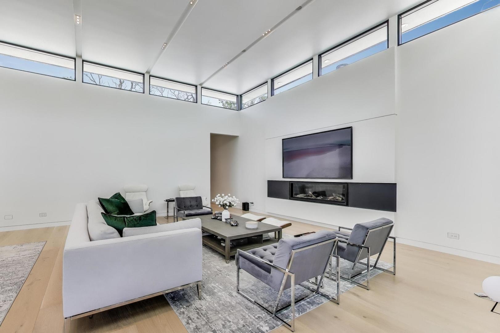 821 Harms Road Glenview, IL 60025 - Photo 9 of 41 a living room with furniture and a flat screen tv