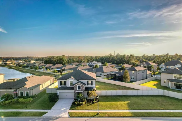an aerial view of a house with a swimming pool