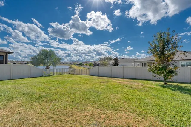 a view of a house with a big yard