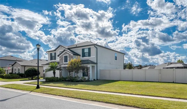 an aerial view of a house with a garden