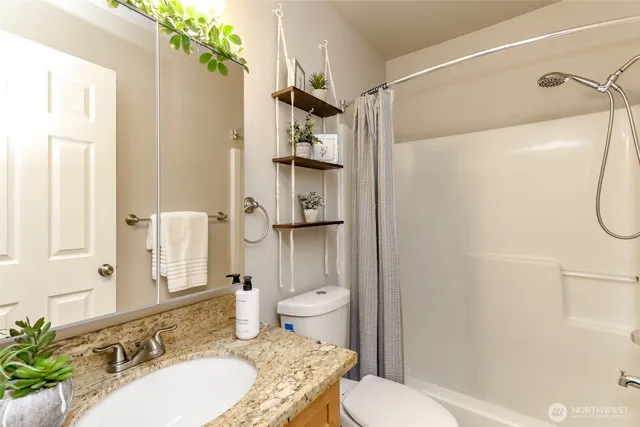 a living room with furniture and a lamp