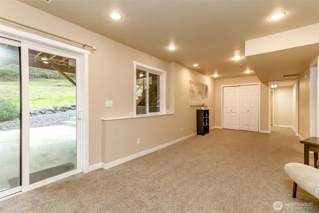 an empty room with furniture and a window