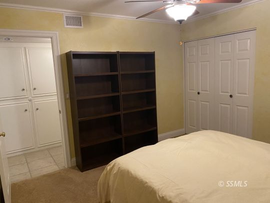 1006 North Sierra View Street Ridgecrest, CA 93555 - Photo 18 of 36 a bedroom with a bed and a closet