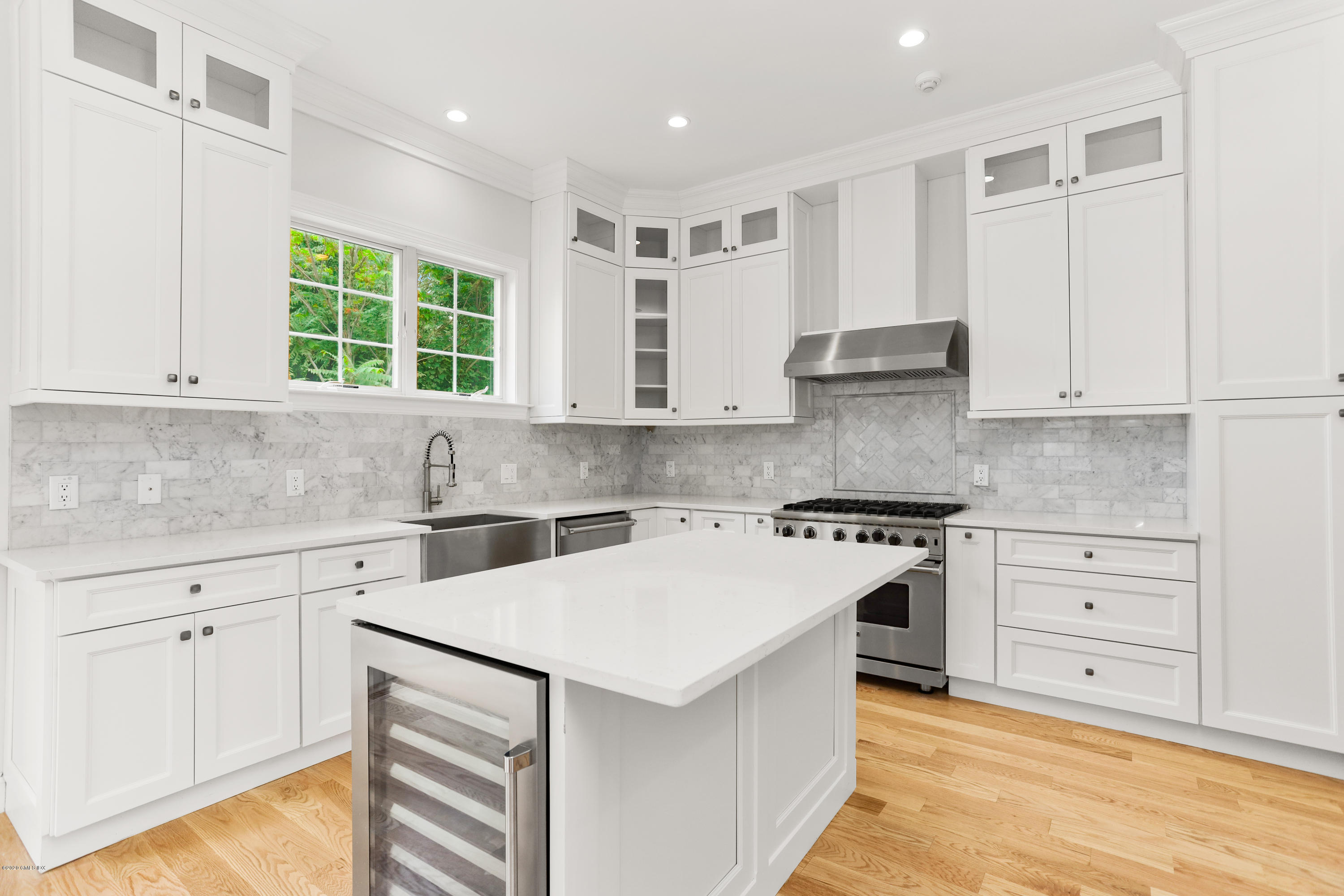 125 Hamilton Avenue, Unit 2 Greenwich, CT 06830 - Photo 2 of 20 a kitchen with a stove a sink and a window