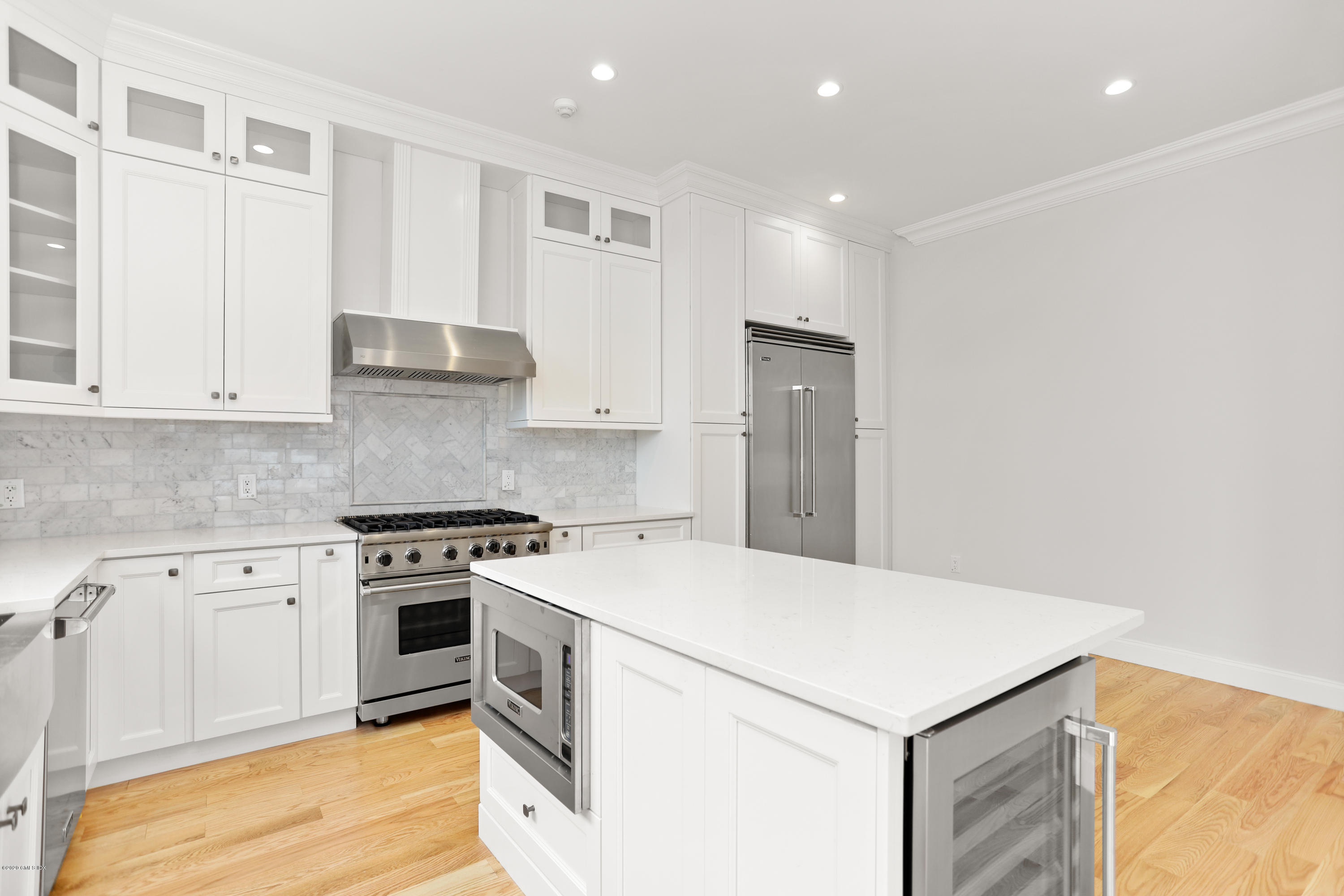 125 Hamilton Avenue, Unit 2 Greenwich, CT 06830 - Photo 3 of 20 a kitchen with a stove a sink and a refrigerator