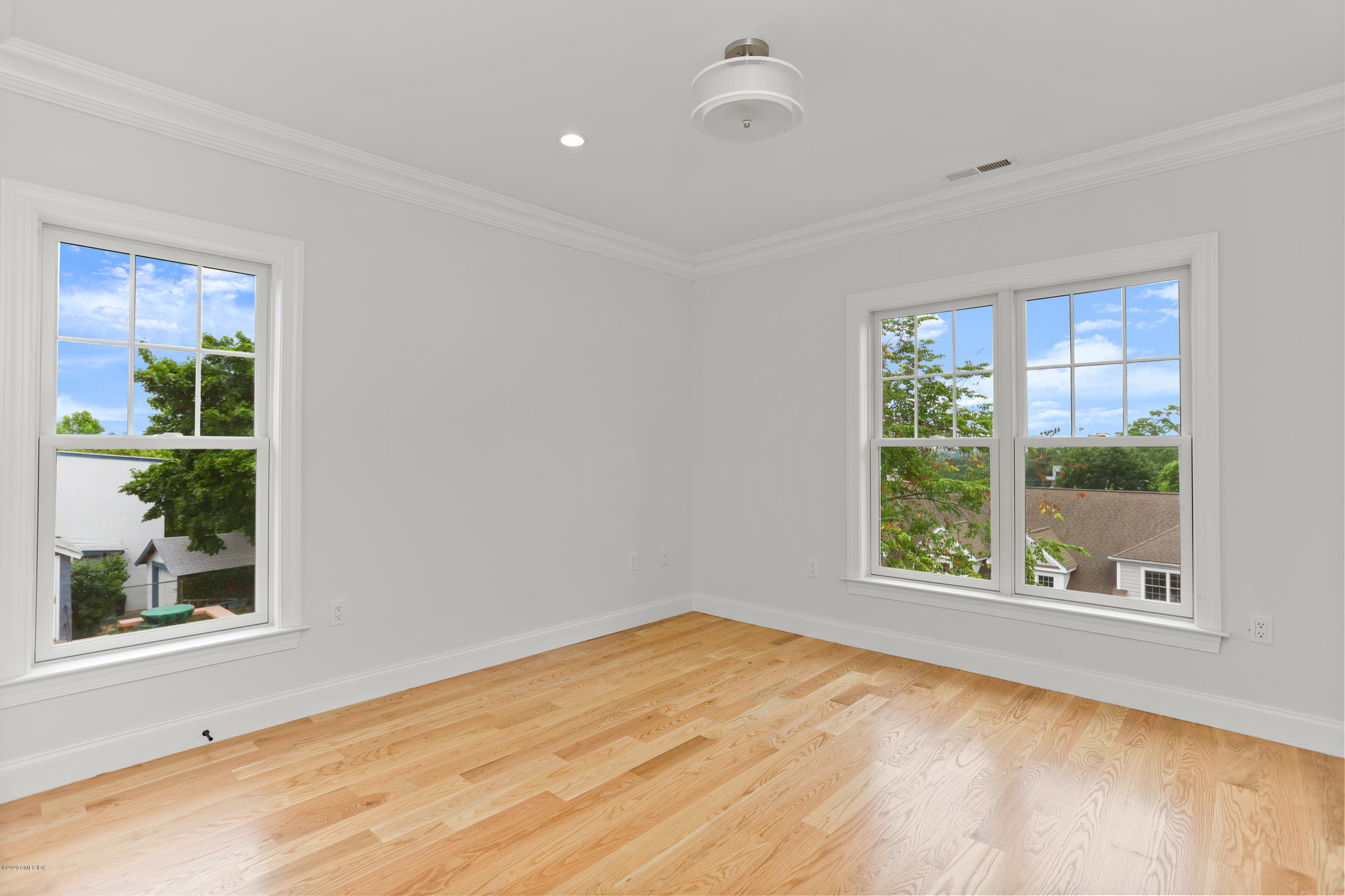 125 Hamilton Avenue, Unit 2 Greenwich, CT 06830 - Photo 10 of 20 a view of an empty room with a window