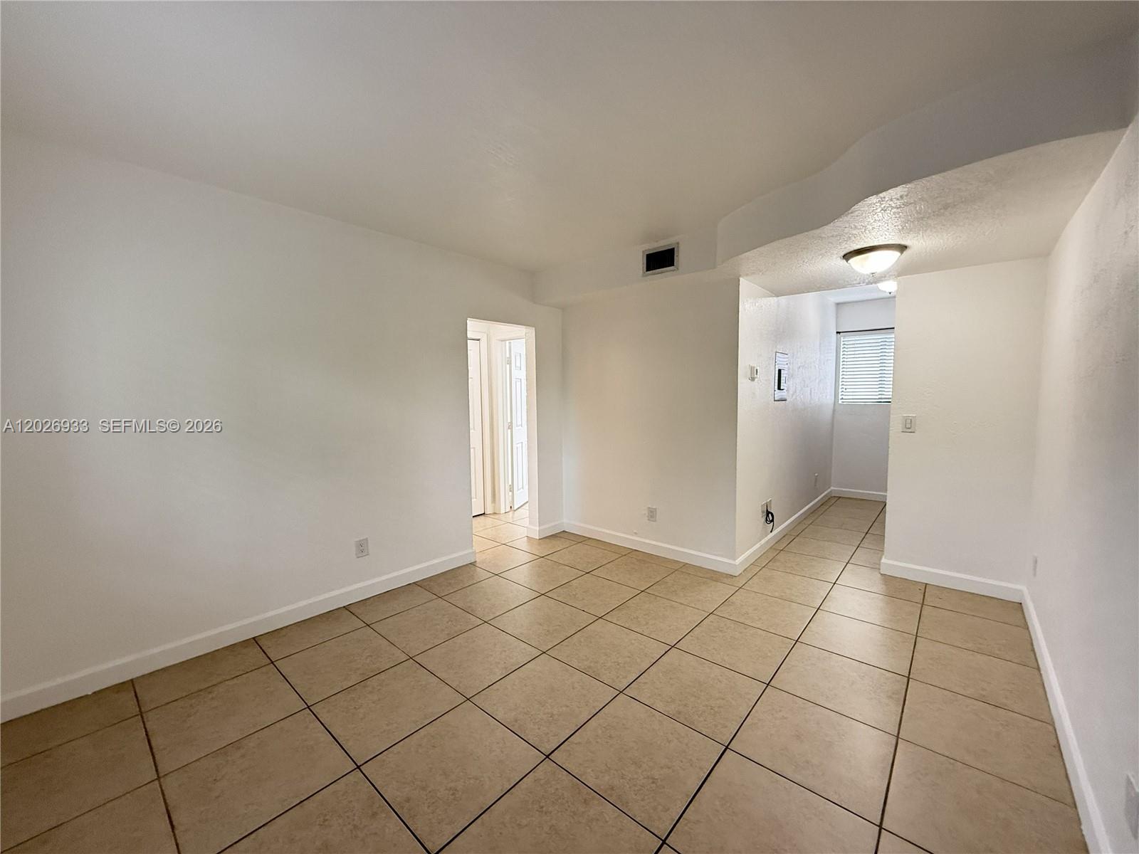 421 Southwest 6th Street, Unit 7 Miami, FL 33130 - Photo 2 of 8 a view of an empty room and window