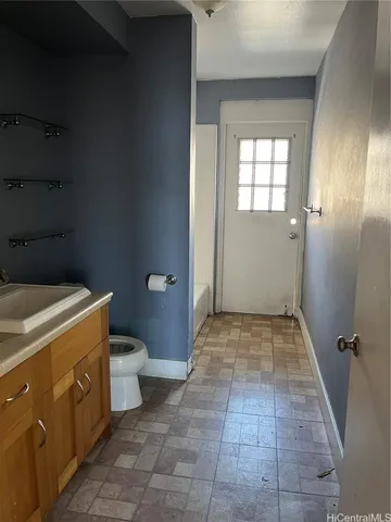 a bathroom with a sink and toilet