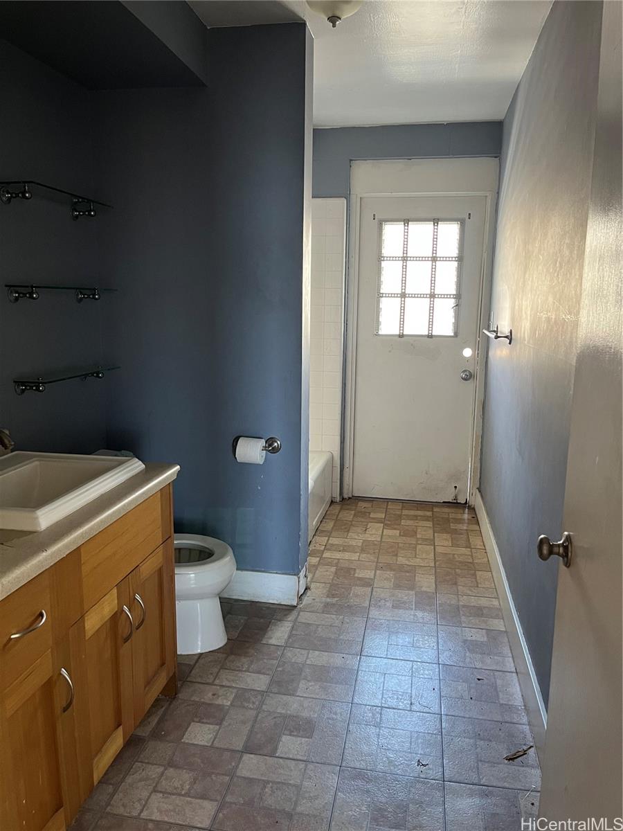 1516 Emerson Street, Unit 104 Honolulu, HI 96813 - Photo 5 of 9 a bathroom with a sink and toilet