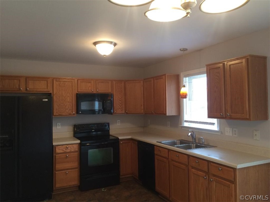 6330 Oak Drive Quinton, VA 23141 - Photo 11 of 21 a kitchen with a sink stove and microwave