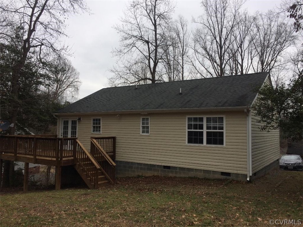6330 Oak Drive Quinton, VA 23141 - Photo 2 of 21 a backyard of a house with wooden fence and large tree