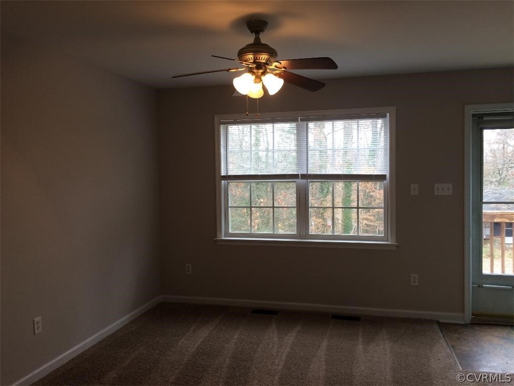 6330 Oak Drive Quinton, VA 23141 - Photo 9 of 21 a view of an empty room with wooden floor and a window
