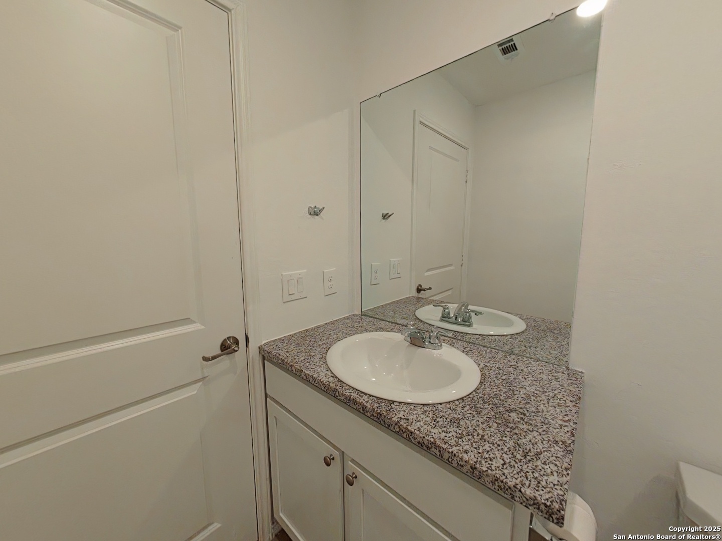 12039 Still Pass San Antonio, TX 78221 - Photo 14 of 19 a bathroom with a granite countertop sink and mirror