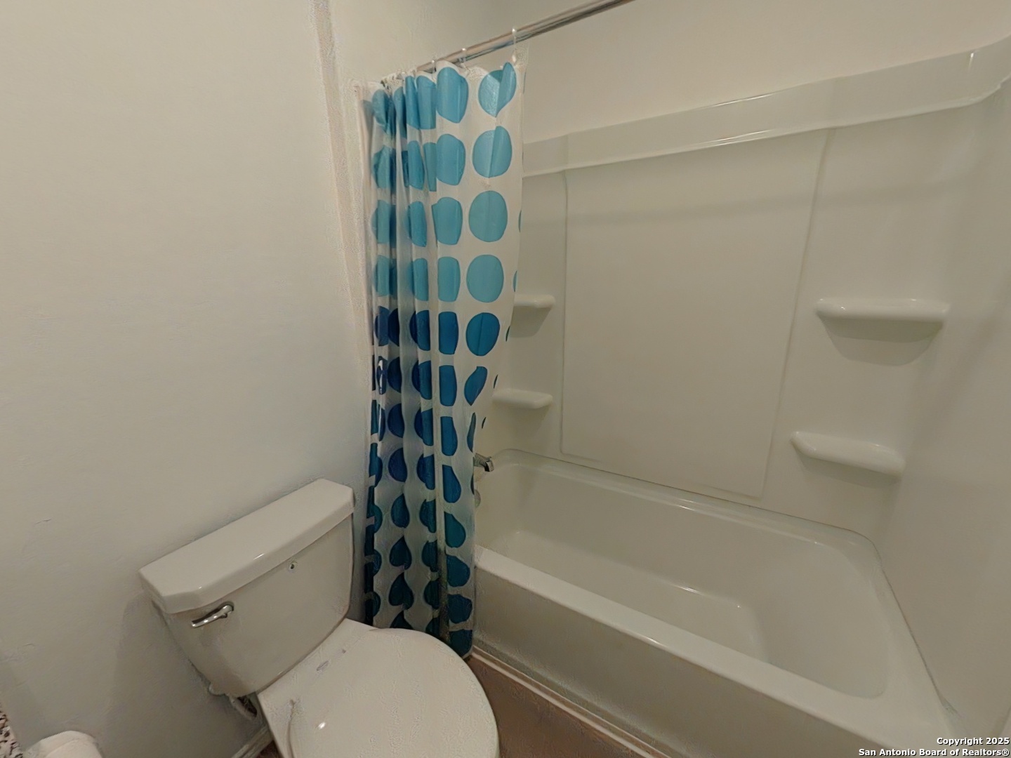 12039 Still Pass San Antonio, TX 78221 - Photo 15 of 19 a bathroom with a toilet and a bathtub