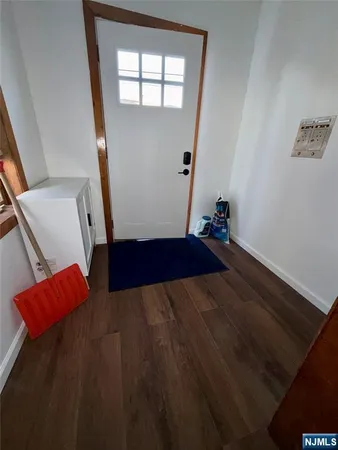 a view of wooden floor and windows in an empty room