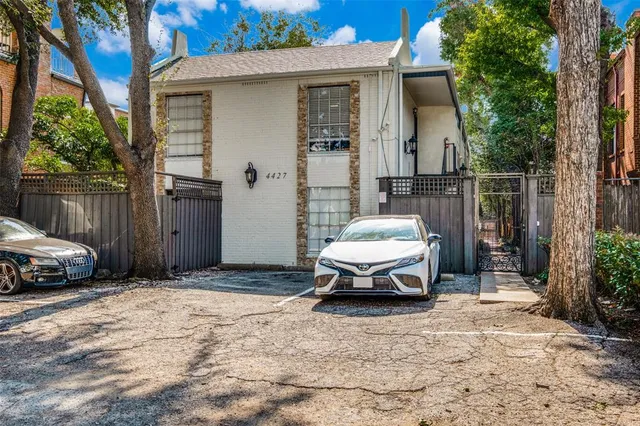 a car parked in front of a house