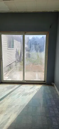 an empty room with a yard