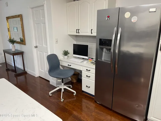 a workspace with furniture and wooden floor
