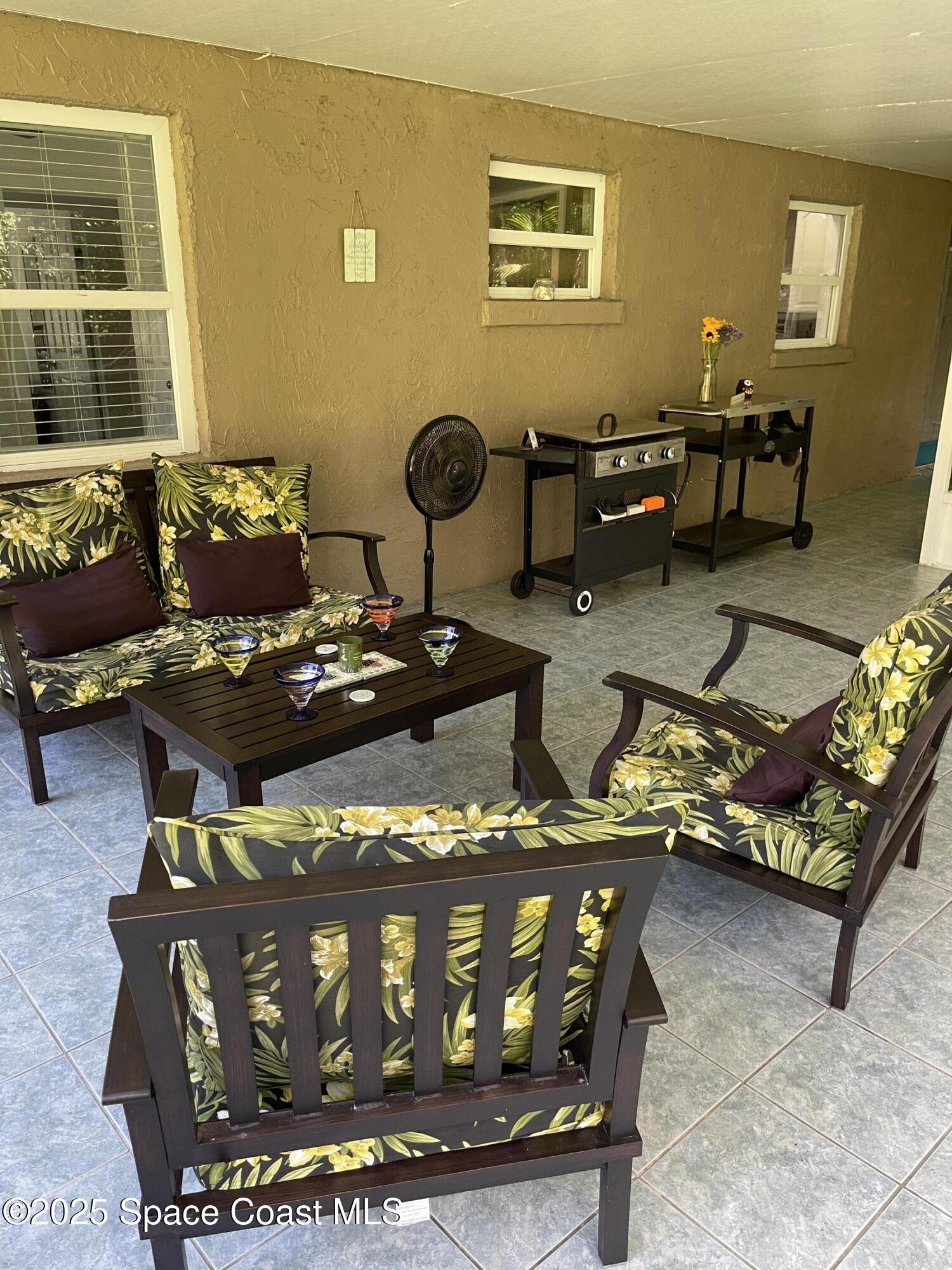 6910 Sheridan Road Melbourne, FL 32904 - Photo 31 of 38 a room with furniture and window