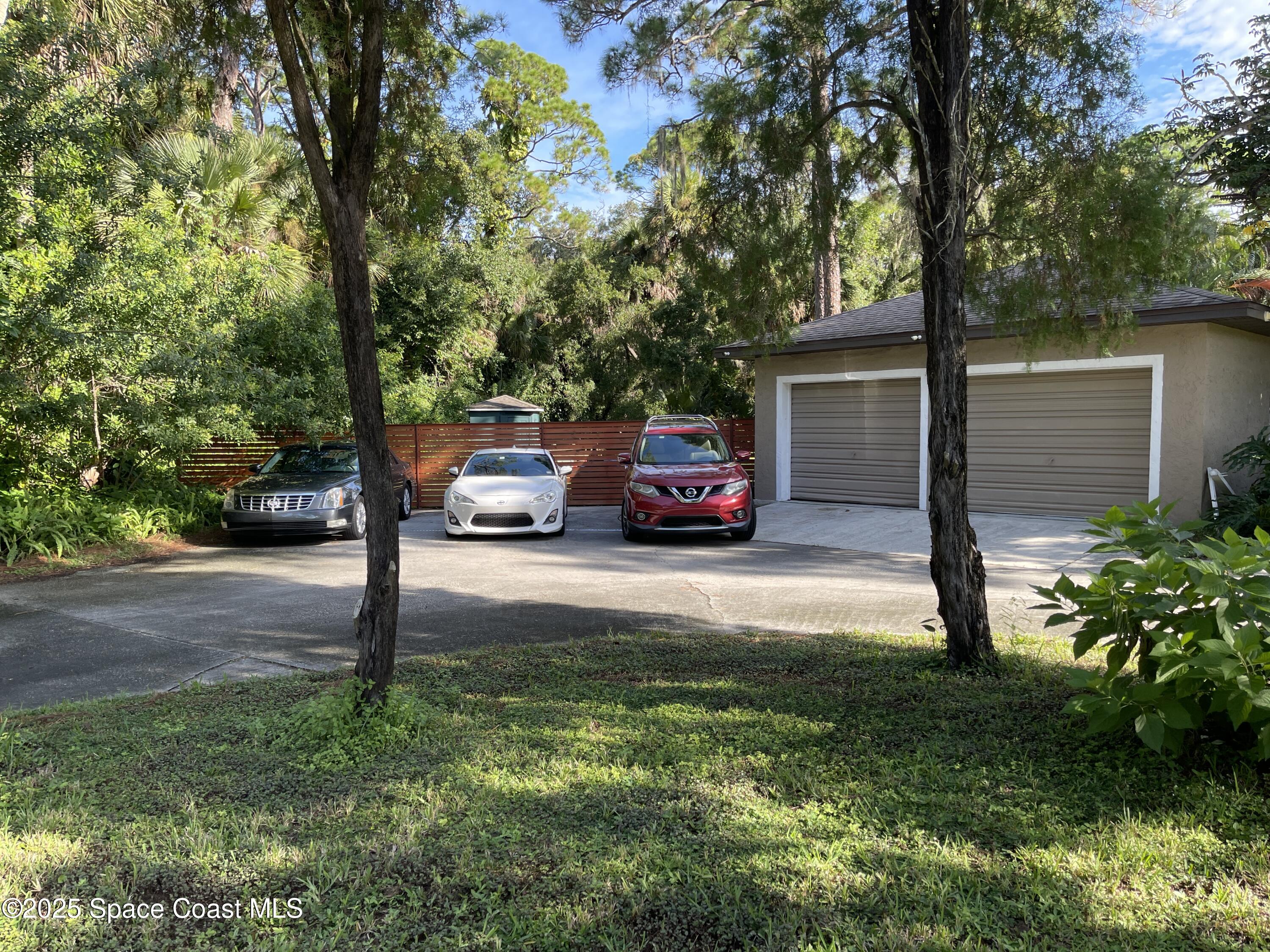 6910 Sheridan Road Melbourne, FL 32904 - Photo 34 of 38 a view of street with parked cars