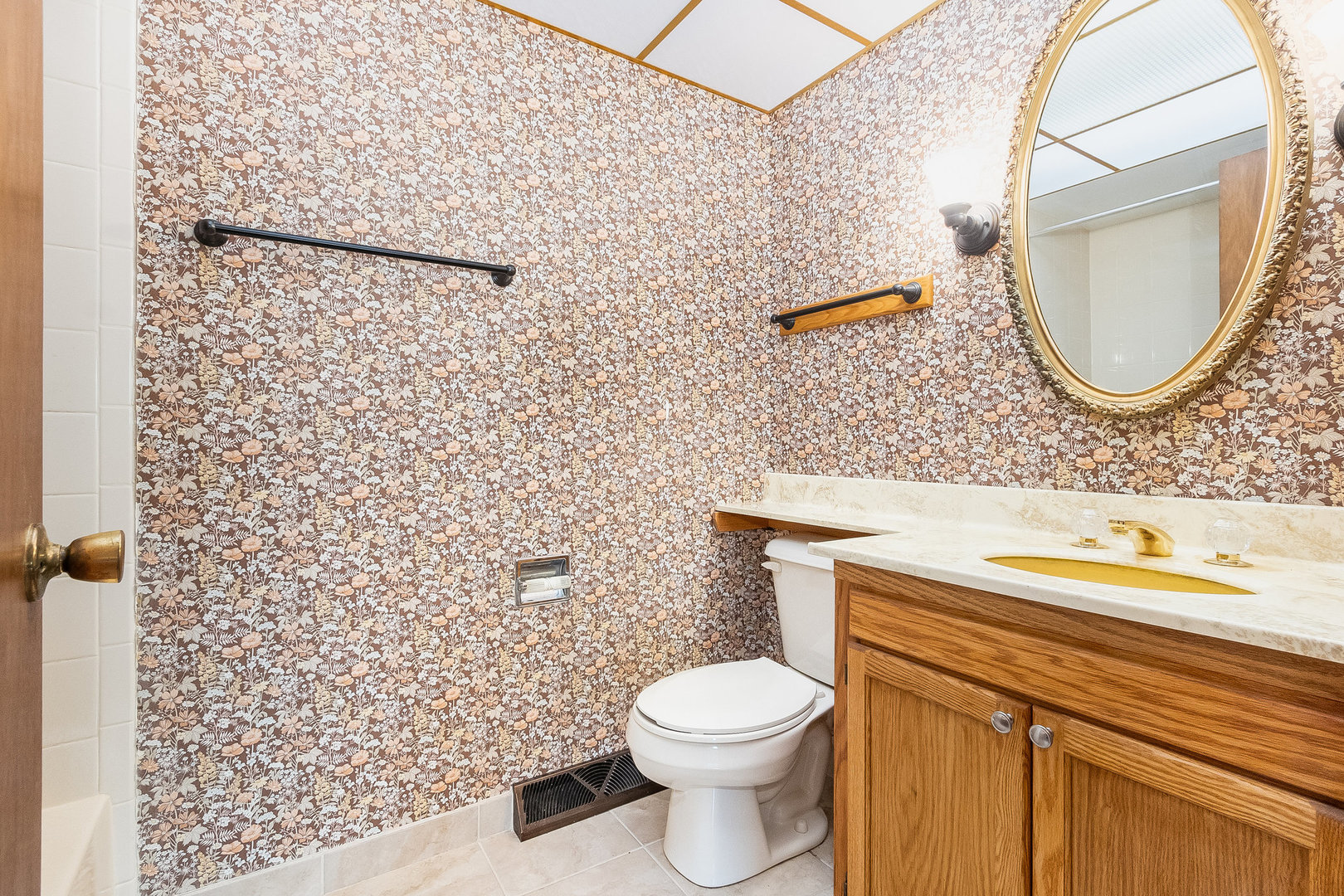 17010 Gaynelle Road Tinley Park, IL 60477 - Photo 13 of 19 a bathroom with a toilet sink vanity and mirror