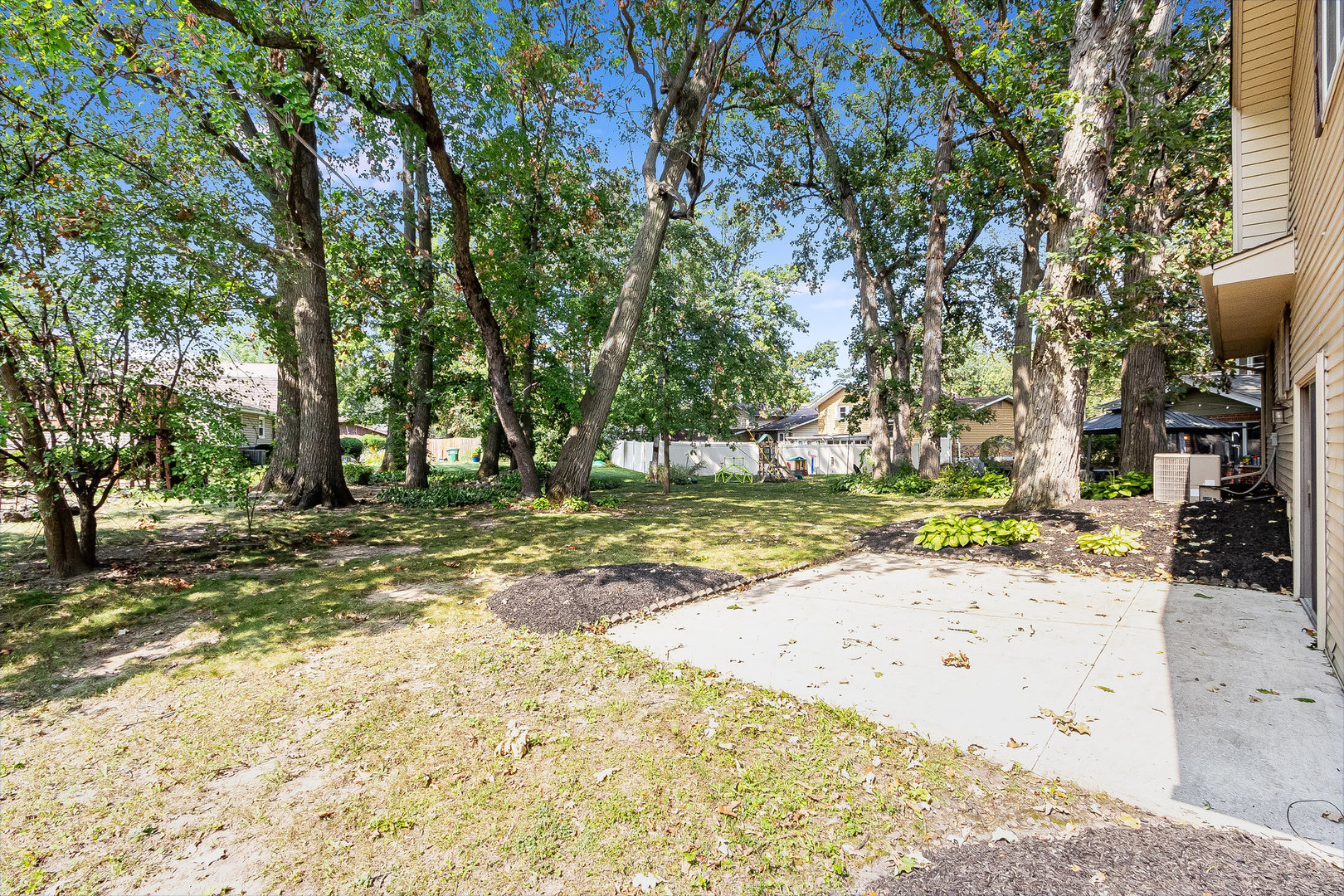 17010 Gaynelle Road Tinley Park, IL 60477 - Photo 14 of 19 a view of a yard with plants and trees