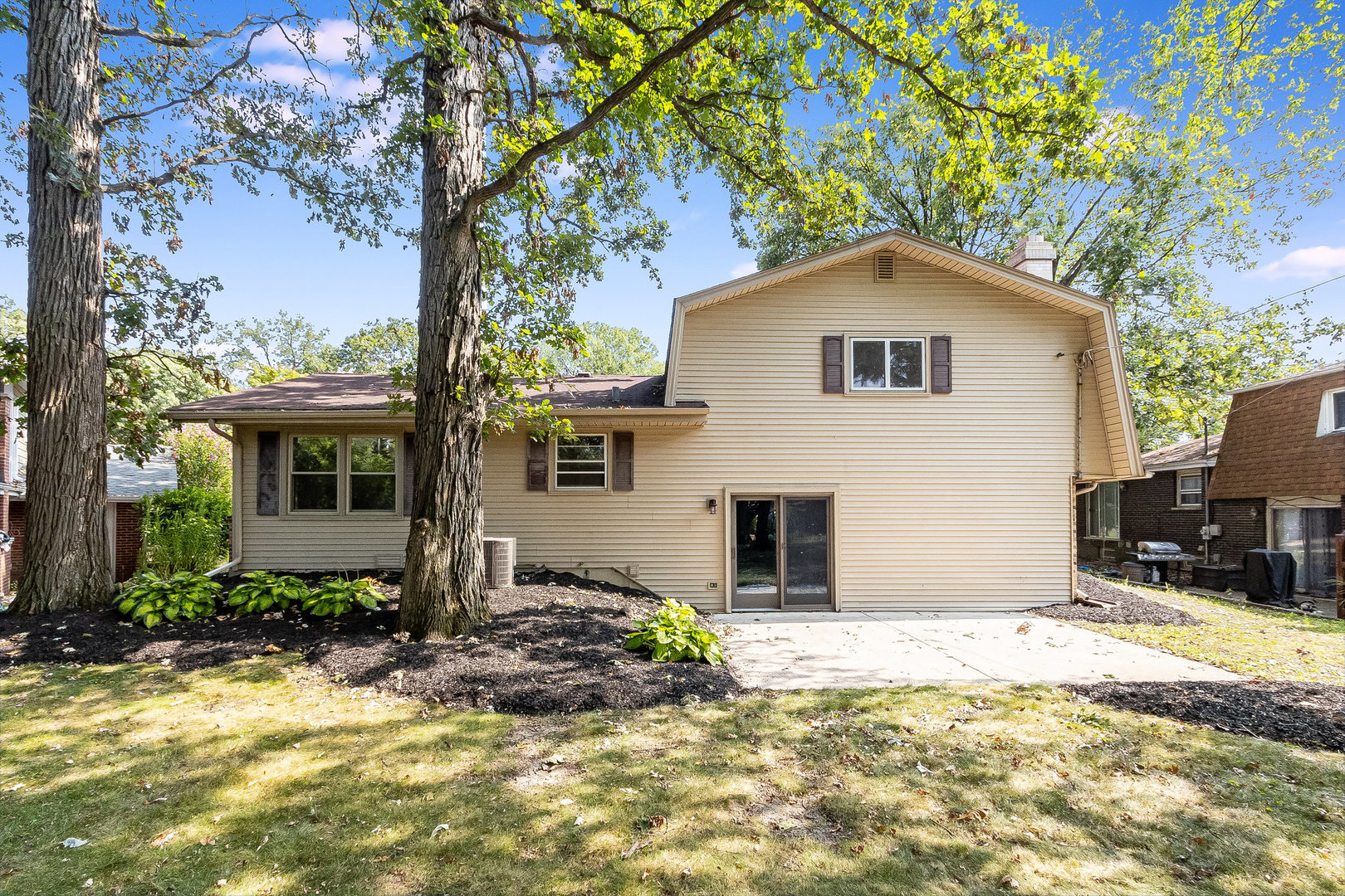 17010 Gaynelle Road Tinley Park, IL 60477 - Photo 15 of 19 a house with trees in the background