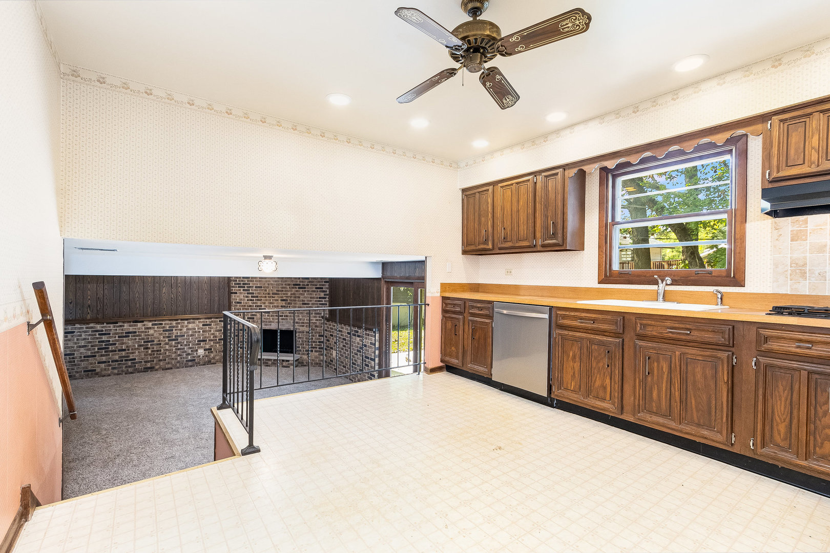 17010 Gaynelle Road Tinley Park, IL 60477 - Photo 5 of 19 a kitchen with stainless steel appliances kitchen island granite countertop a refrigerator a sink a stove a dining table and chairs with wooden floor